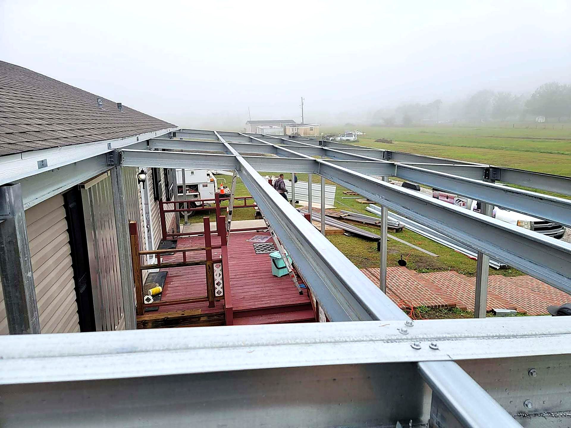 Steel patio cover frame built over an existing timber deck