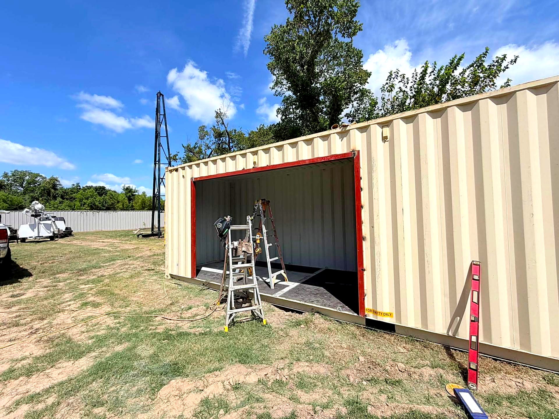 Shipping container with a newly framed side opening