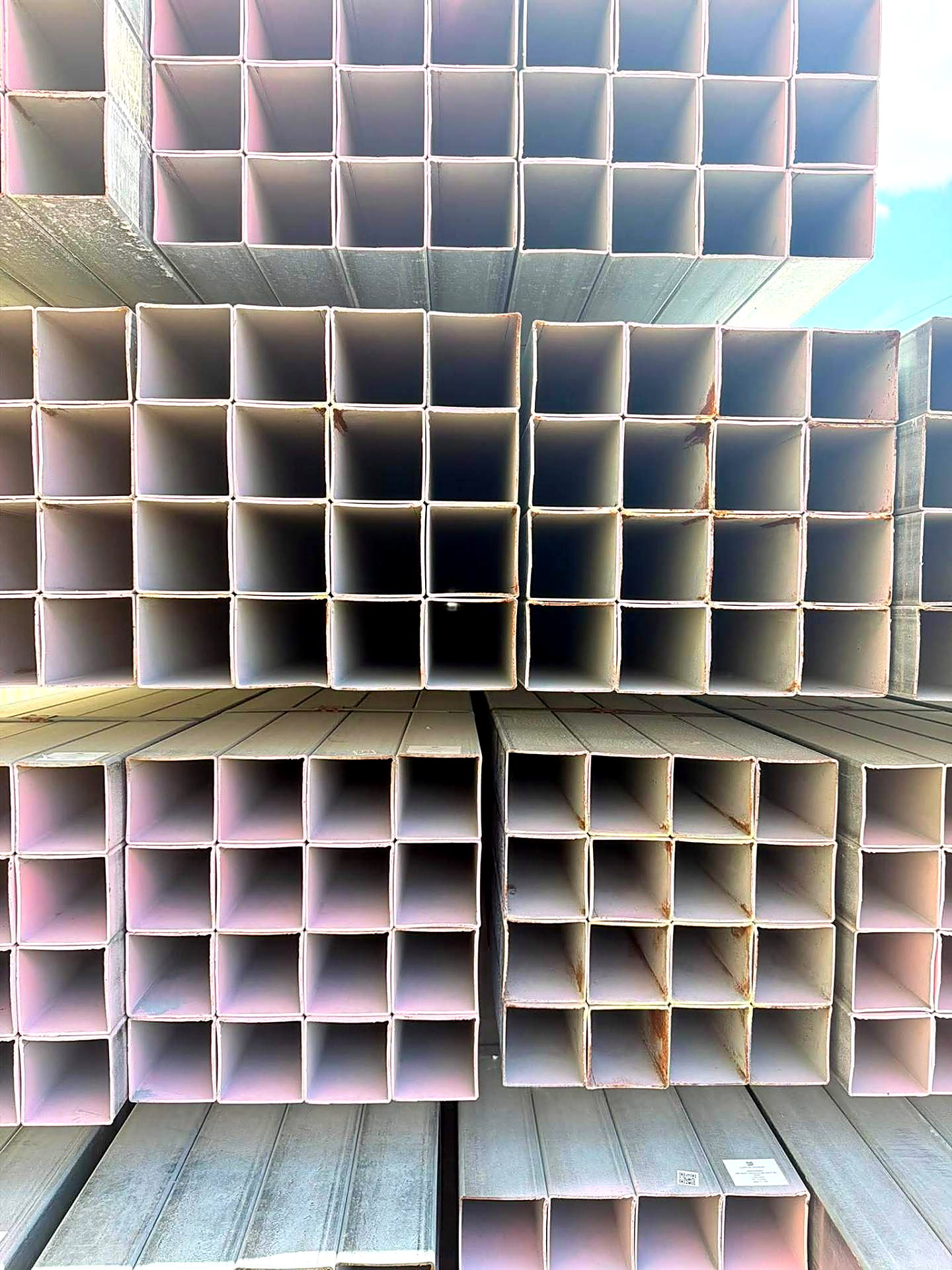 Stacked galvanized square steel tubing ready for sale