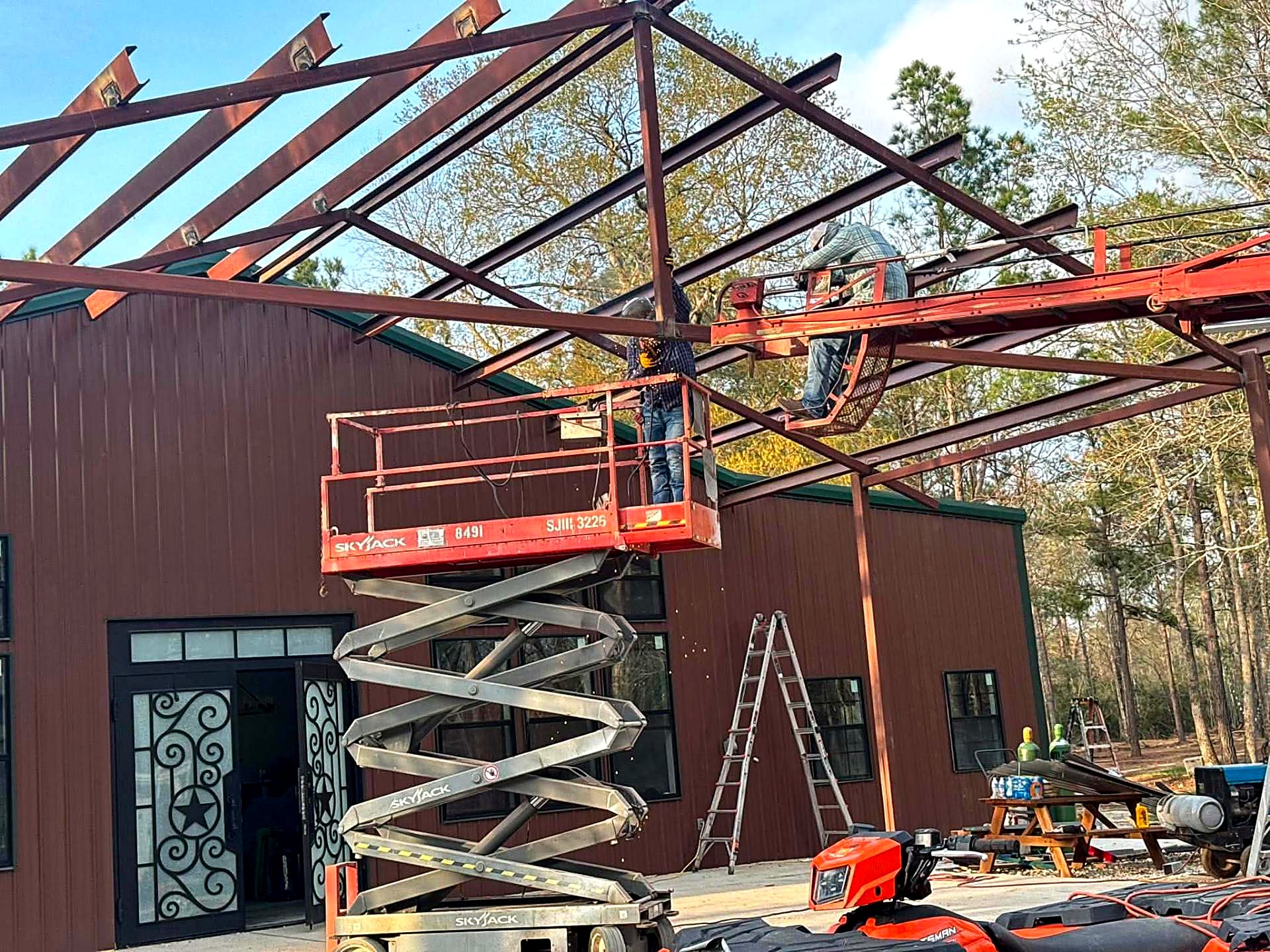 Steel rafters and purlins set across a new patio structure