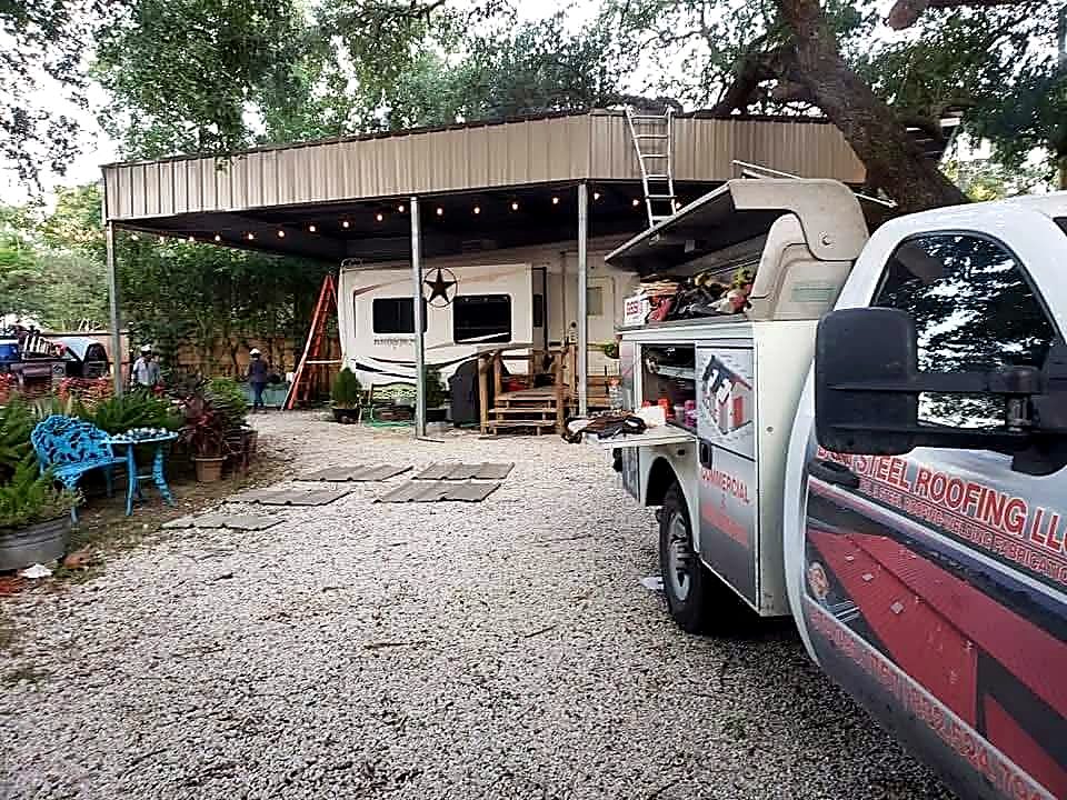 B&R Steel Roofing service truck parked at a completed RV cover installation